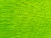 Tablecloth surface with green, light yellow streaks, beautiful for the background.