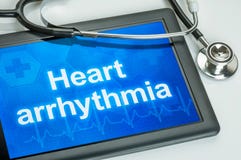 Tablet with the text Heart arrythmia the display stock photo Tablet with the text Heart arrythmia the display stock photo