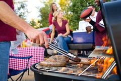 Tailgating: Bratwurst or Sausage On The Grill At Tailgate Party Royalty Free Stock Photos Tailgating: Bratwurst or Sausage On The Grill At Tailgate Party Royalty Free Stock Photos