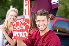 Tailgating: Football Fan Holds Up Number One Foam Finger stock photos Tailgating: Football Fan Holds Up Number One Foam Finger stock photos
