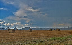Hay bale water colours within a torrential downpour. stock photography Hay bale water colours within a torrential downpour. stock photography
