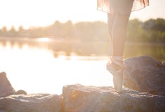 Talented ballerina with pointe shoes on the beach at sunset royalty free stock photos Talented ballerina with pointe shoes on the beach at sunset royalty free stock photos