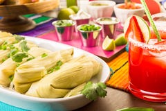 Tamales. Home made tamales on serving plate on the party table Tamales. Home made tamales on serving plate on the party table