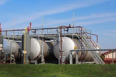 Tanks - elements of oil pump station. Tansport and distribution of oil. Technology of oil transportation system. Training manual f royalty free stock photography Tanks - elements of oil pump station. Tansport and distribution of oil. Technology of oil transportation system. Training manual f royalty free stock photography