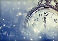 Tarjeta de felicitación del Año Nuevo con las luces del reloj y del día de fiesta del vintage Fotos de archivo libres de regalías
