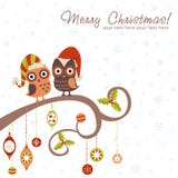 Tarjeta de Navidad de buhos en sombreros stock de ilustración Tarjeta de Navidad de buhos en sombreros stock de ilustración