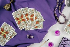 tarot-cards-fanned-back-up-purple-cloth-
