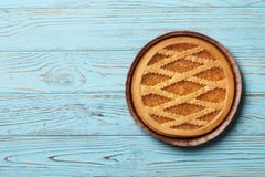 Tasty cake with jam on а blue wooden background royalty free stock photography Tasty cake with jam on а blue wooden background royalty free stock photography