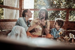 Cheerful family enjoying their food in garden house stock images Cheerful family enjoying their food in garden house stock images