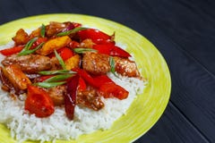 Tasty spicy stir-fry chicken with rice and roasted vegetables in royalty free stock images Tasty spicy stir-fry chicken with rice and roasted vegetables in royalty free stock images