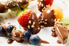 Tasty summer fruit treats dipped in chocolate stock photos Tasty summer fruit treats dipped in chocolate stock photos