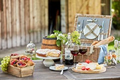 Tasty summer picnic al fresco on a garden table royalty free stock photo Tasty summer picnic al fresco on a garden table royalty free stock photo