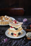 Tea And Sweets On A Dark Background, Mille-feuille, Eclairs, Tart, Decorative With Flowers, Selective Focus, Closeup Stock Image