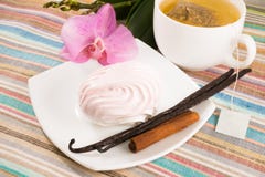 Tea Bag And Pink Marshmallow On A Saucer With A Vanilla, Cinnamon Royalty Free Stock Images Tea Bag And Pink Marshmallow On A Saucer With A Vanilla, Cinnamon Royalty Free Stock Images