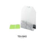 Tea Bag With Green Label. Stock Photo