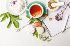tea with cakes, and fruit on a white table royalty free stock photo tea with cakes, and fruit on a white table royalty free stock photo