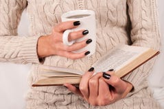 Tea Cup And Book In Girl Hands With Black Nails Stock Photography