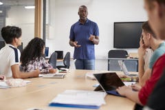 Teacher In Lesson For College Students Studying CAD/3D Design royalty free stock images Teacher In Lesson For College Students Studying CAD/3D Design royalty free stock images