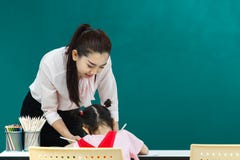 Teacher pay attention at girl stock photo Teacher pay attention at girl stock photo