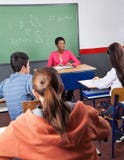 Teacher And Teenage Students Sitting In Classroom Royalty Free Stock Photos Teacher And Teenage Students Sitting In Classroom Royalty Free Stock Photos