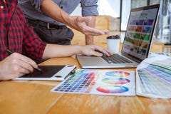 Team of Creative graphic designer meeting working on new project, choose selection color and drawing on graphics tablet with work stock images Team of Creative graphic designer meeting working on new project, choose selection color and drawing on graphics tablet with work stock images