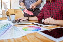 Team of Creative graphic designer meeting working on new project, choose selection color and drawing on graphics tablet with work royalty free stock images Team of Creative graphic designer meeting working on new project, choose selection color and drawing on graphics tablet with work royalty free stock images