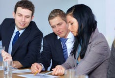 Team Of 3 Business People Work On Some Paperwork Royalty Free Stock Image Team Of 3 Business People Work On Some Paperwork Royalty Free Stock Image