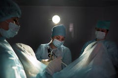 Team of surgeons performing operation royalty free stock photo Team of surgeons performing operation royalty free stock photo