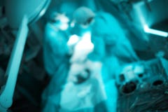 Team of working doctors, unfocused background stock image Team of working doctors, unfocused background stock image