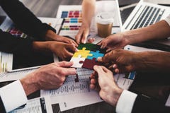 Teamwork of partners. Concept of integration and startup with puzzle pieces stock photos Teamwork of partners. Concept of integration and startup with puzzle pieces stock photos