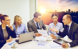 Business team with laptop having discussion stock photos Business team with laptop having discussion stock photos