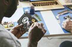 Technician is working on computer hard disk stock photography Technician is working on computer hard disk stock photography