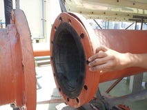 Coupling flange.The worker are holding rubber gaskets on the Rubber Expansion Joint for Cooling Tower. Close-up. royalty free stock photo Coupling flange.The worker are holding rubber gaskets on the Rubber Expansion Joint for Cooling Tower. Close-up. royalty free stock photo