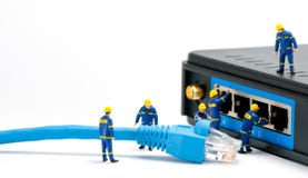 Technicians connecting network cable