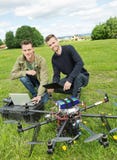 Technicians With Laptop And Digital Tablet By UAV royalty free stock photography Technicians With Laptop And Digital Tablet By UAV royalty free stock photography