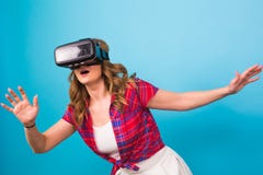 Technology, virtual reality, entertainment and people concept - Woman with virtual reality goggles Stock Images Technology, virtual reality, entertainment and people concept - Woman with virtual reality goggles Stock Images