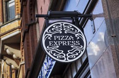 Tecken och logo för pizza uttryckligt royaltyfri foto Tecken och logo för pizza uttryckligt royaltyfri foto