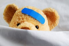 Teddybär im Bett