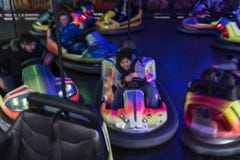 Teen boy having fun to drive a bumper car at the fun fair , motion blur image Stock Image Teen boy having fun to drive a bumper car at the fun fair , motion blur image Stock Image