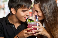 Teen couple sharing cocktail. royalty free stock photo Teen couple sharing cocktail. royalty free stock photo
