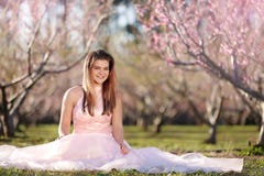 Teen girl in a field of cherry blossoms royalty free stock images Teen girl in a field of cherry blossoms royalty free stock images