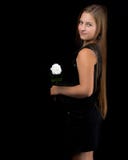 Teenage girl with a flower in her hand stock photo Teenage girl with a flower in her hand stock photo