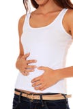 Teenage girl suffers from stomach cramps stock photography Teenage girl suffers from stomach cramps stock photography