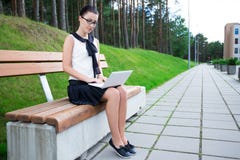 Teenage Girl Using Laptop In Park Or Campus Royalty Free Stock Photo Teenage Girl Using Laptop In Park Or Campus Royalty Free Stock Photo