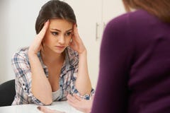 Teenage Girl Visiting Counsellor To Treat Depression