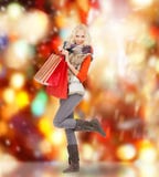 Teenage girl in winter clothes with shopping bags Stock Photography Teenage girl in winter clothes with shopping bags Stock Photography