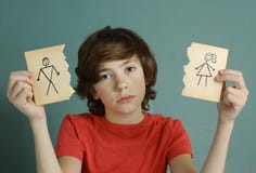 Teenager boy hold mom and dad drawing in two torn paper pieces stock image Teenager boy hold mom and dad drawing in two torn paper pieces stock image