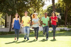 Teenagers Running Through Park Royalty Free Stock Photography Teenagers Running Through Park Royalty Free Stock Photography