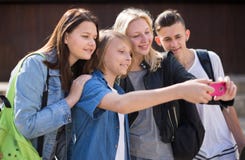 Teenagers taking pictures of themselves on smartphone Stock Photography Teenagers taking pictures of themselves on smartphone Stock Photography