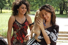 Teens with a little dog royalty free stock images Teens with a little dog royalty free stock images